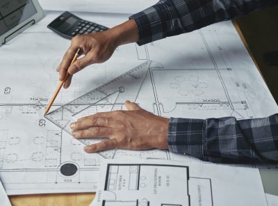 Close-up image of businessman working on construction plan